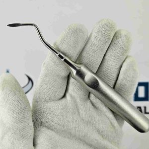 Angled Heidbrink root elevator dental tool with curved tip held in hand for surgical tooth removal