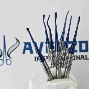 Gloved hand holding a set of blue titanium PDL luxating dental elevators featuring ergonomic knurled handles.