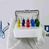 Color-coded dental drill guide positioning kit by Avenzor International in open autoclavable cassette block.