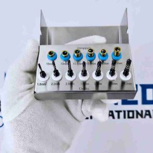 Full dental implant drill kit with color-coded depth stoppers in tray.