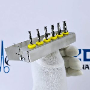 Angled view of long trephine drill bits set ranging from 3.0mm to 6.0mm in surgical metal holder.