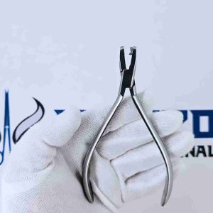 Open view of a stainless steel clear aligner hole punch plier in a gloved hand.