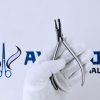 Tear Drop Clear aligner plier-1.jpg Alt Text: Stainless steel tear drop clear aligner plier held by gloved hand.