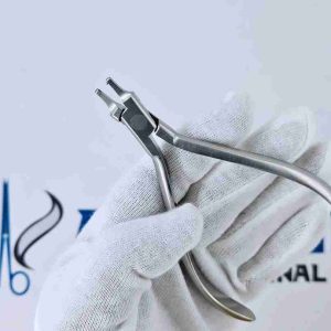 Stainless steel tear drop punch plier held by a gloved hand against an Avenzor International logo.