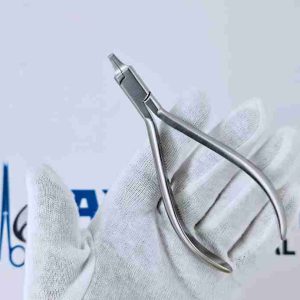 Angled view of a stainless steel tear drop punch plier for orthodontic clear aligners.