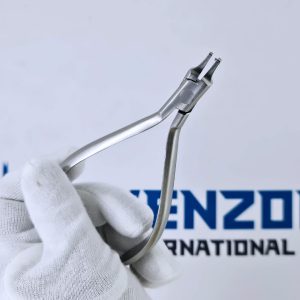 Open view of a tear drop punch plier held by a gloved hand showing handles and box joint.