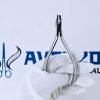 Stainless steel vertical clear aligner plier held by a gloved hand.