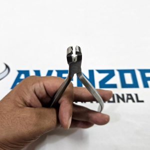 Front head view of Avenzor orthodontic crown removing pliers held in hand.